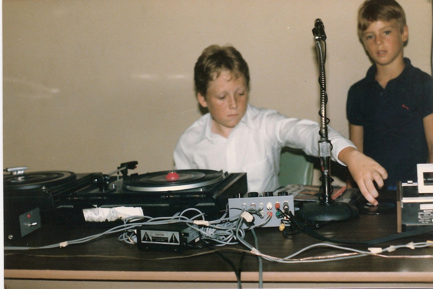 Young DJ Revolution at his uncle's wedding, working his grandfather's turntables and homemade mixer